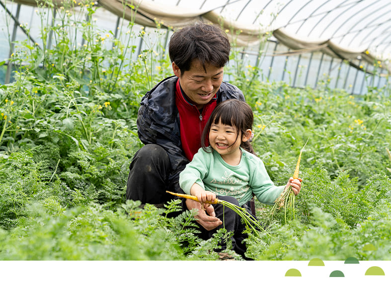 細田さんと子供の写真